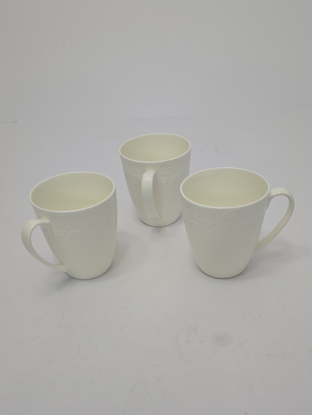 Roscher Set Of 4 Porcelain Cups Mugs Embossed Floral Rim White
